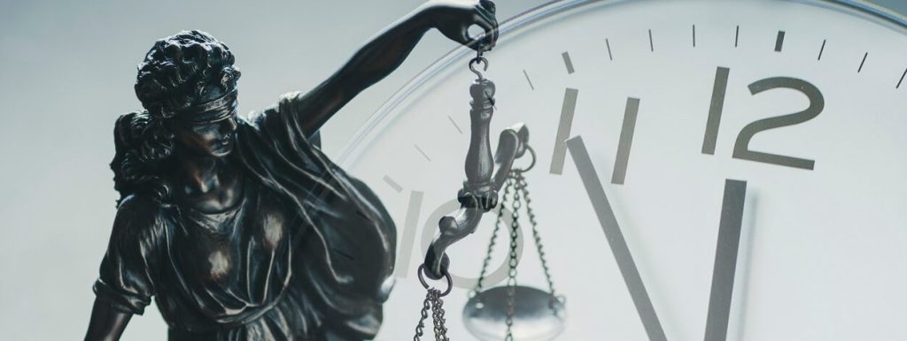 Statue of Justice beside a clock face — limitation periods in Ontario